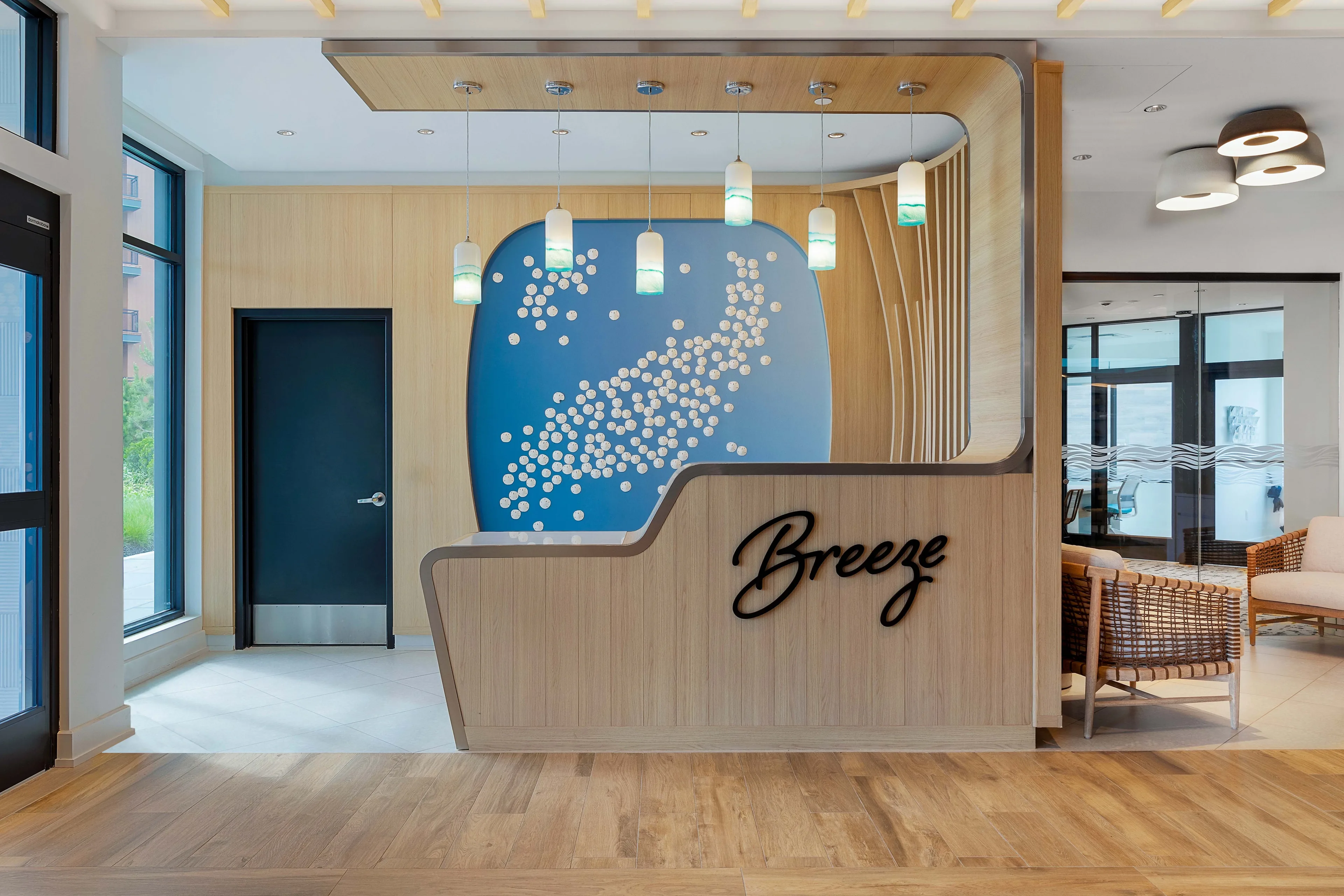 Modern residential lobby and reception area with coastal design