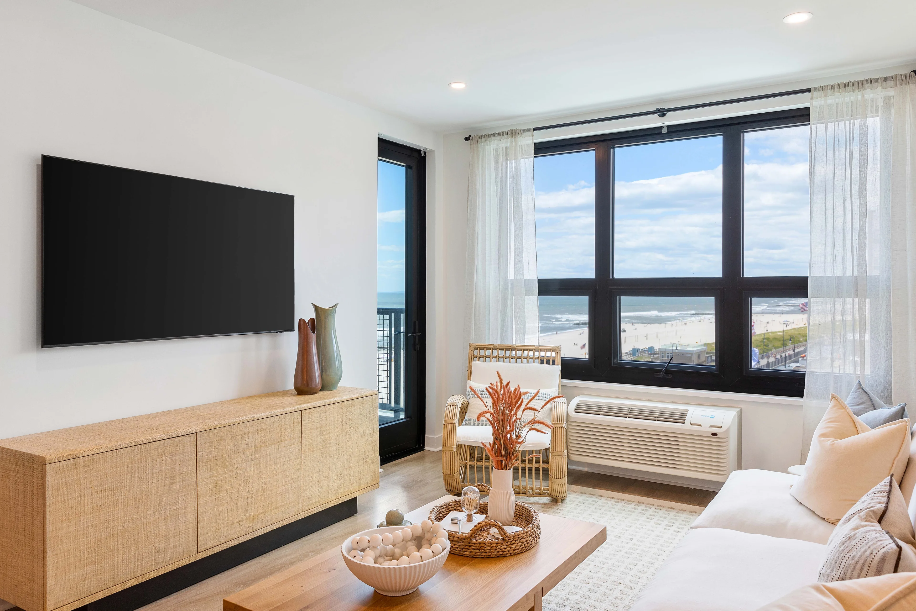 Bright coastal apartment living room with ocean views