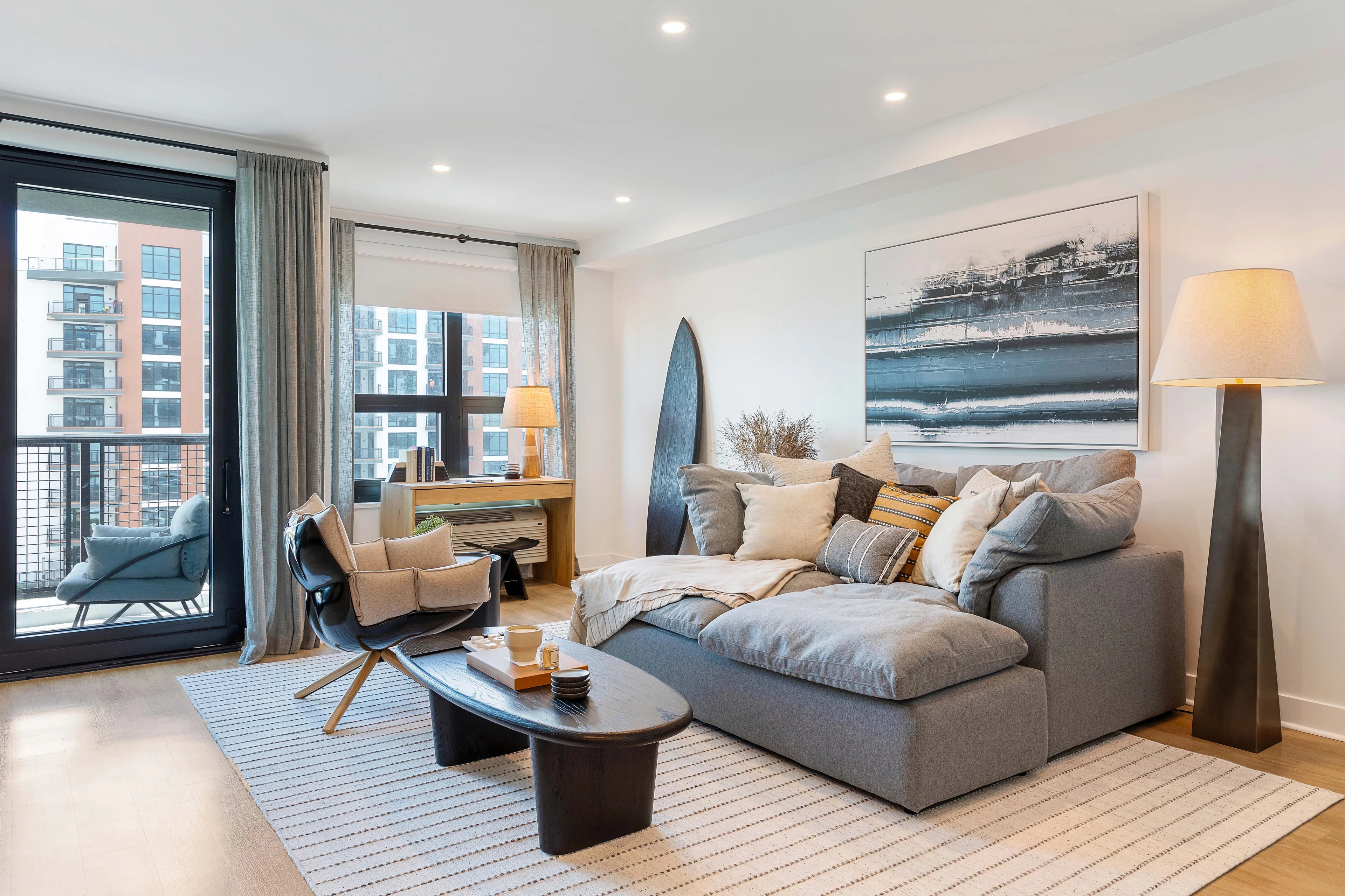 Contemporary apartment living room with balcony and modern furnishings