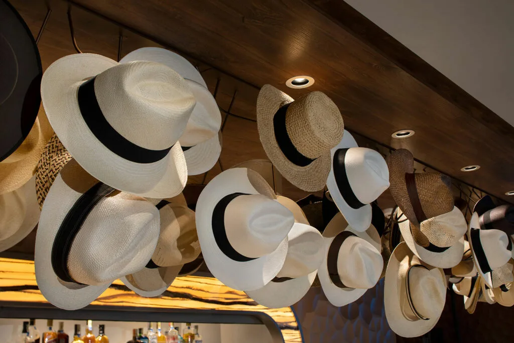 Hanging sun hats above the ship’s bar.