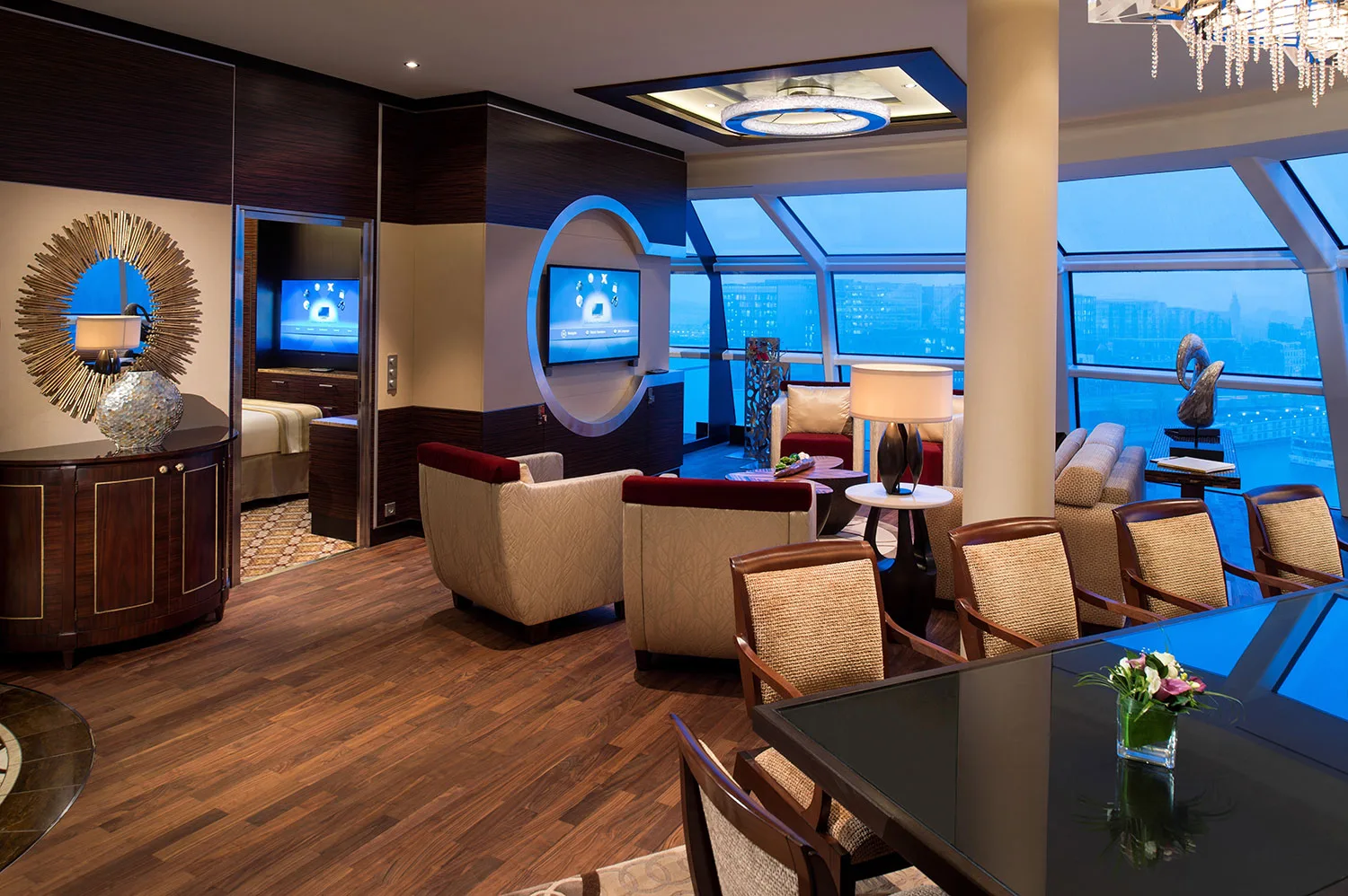 Luxury hotel suite interior with contemporary furnishings and panoramic windows.