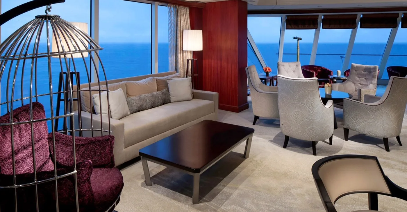 1. Contemporary cruise ship lounge with ocean views, upholstered seating and hanging chair
