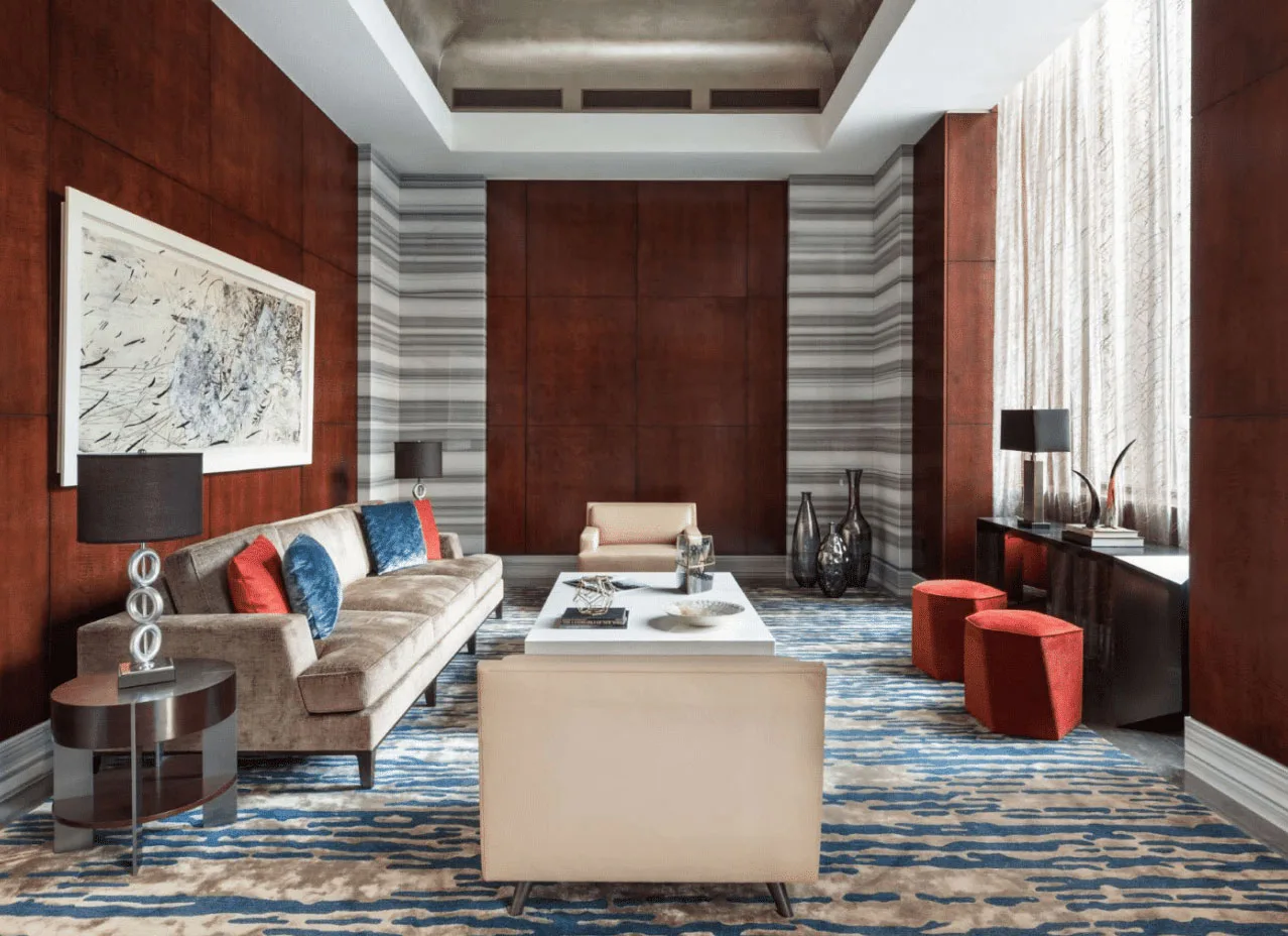 Contemporary resident lounge with custom furnishings and wood-paneled walls
